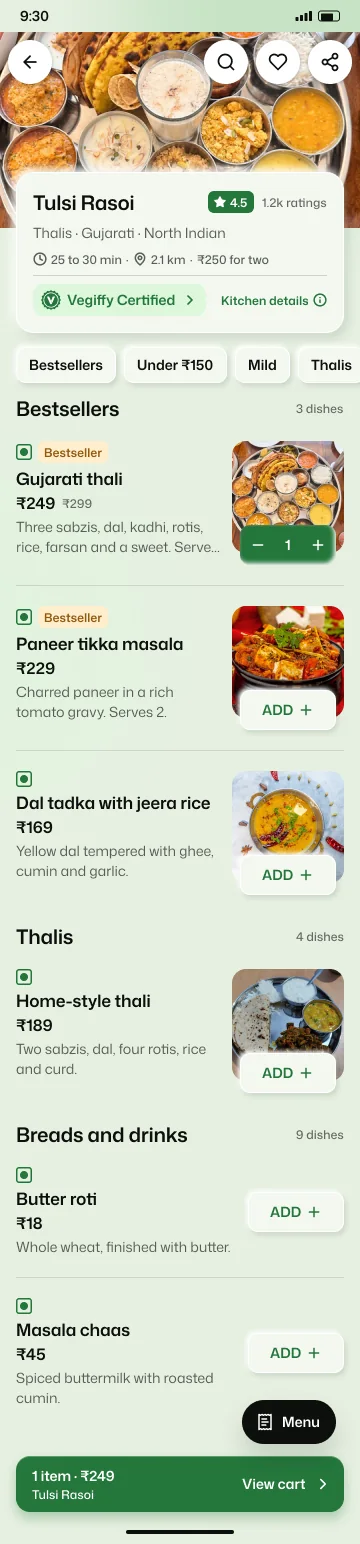 A kitchen page in the Vegiffy app with its rating, cuisines, delivery time and a menu of dishes